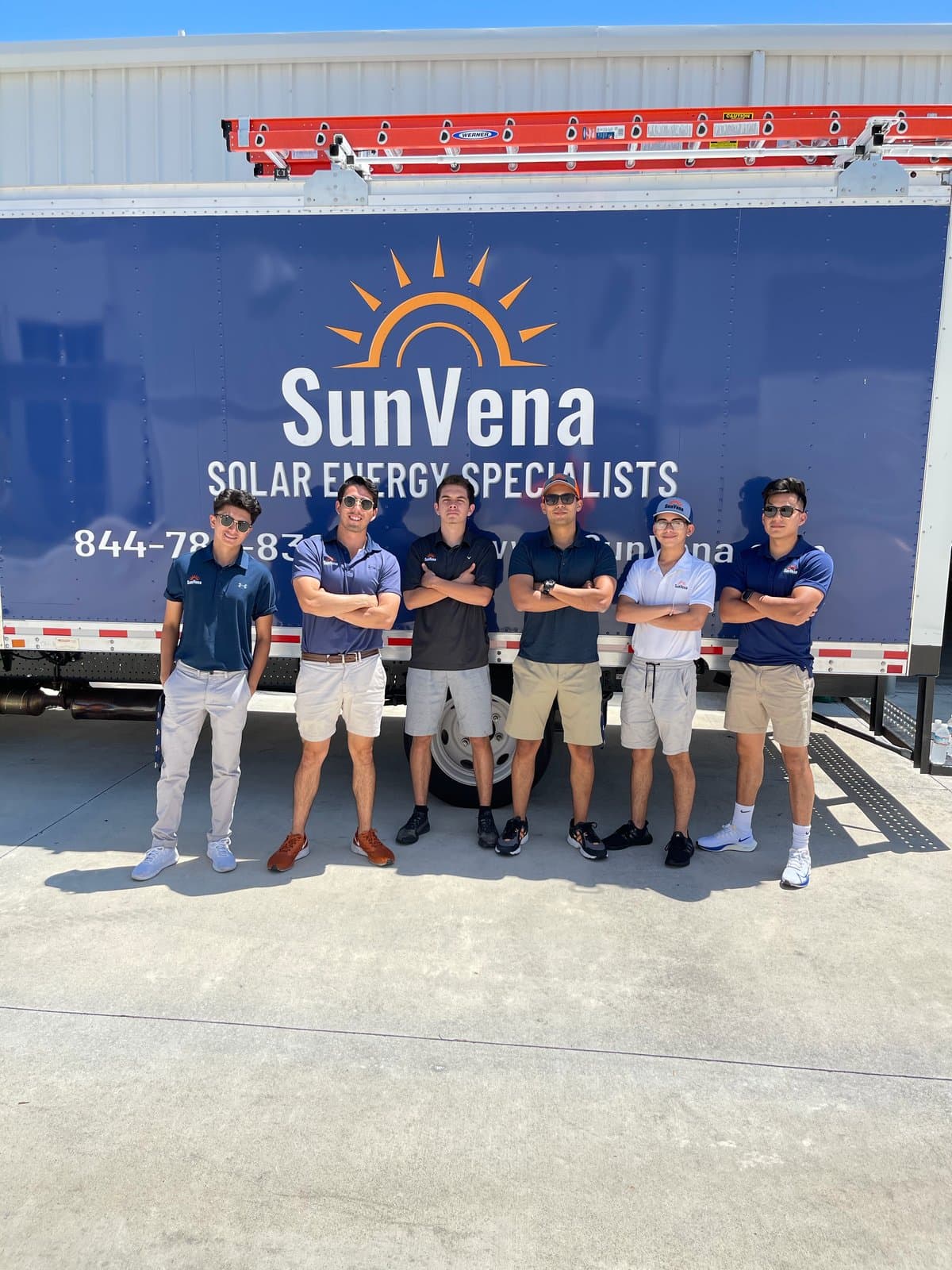 Team MegaWatts reps in front of a SunVena Solar truck